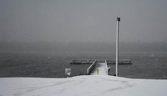 fishing pier in snow storm