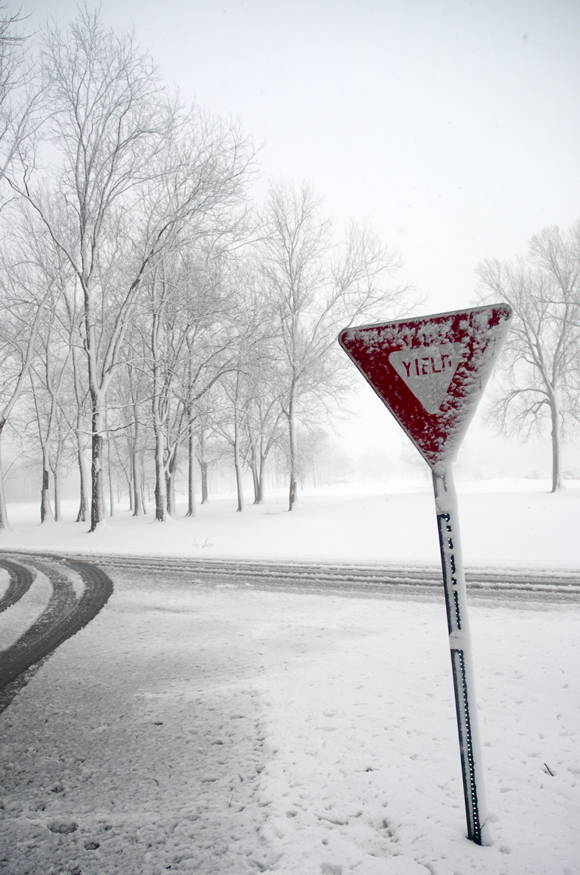 Yield sign in snow storm